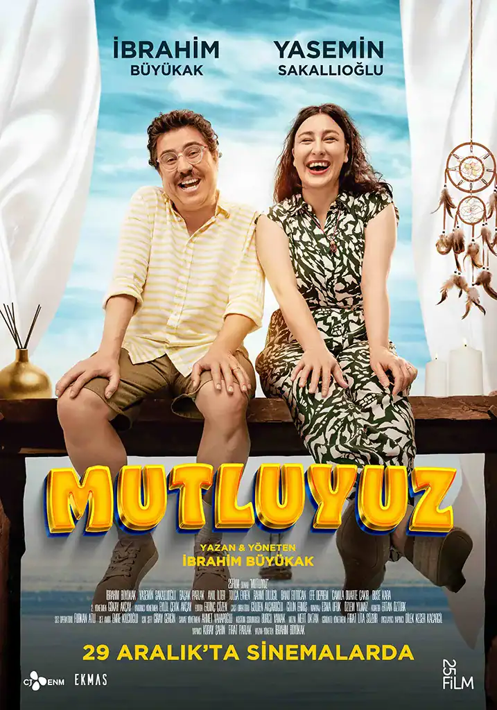 Funny duo sitting on a board, movie poster for "Mutluyuz" directed by Ibrahim Büyükkak.